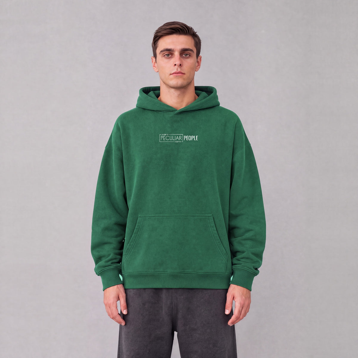 Palmyra map hoodie, front logo on model - Eden Green
