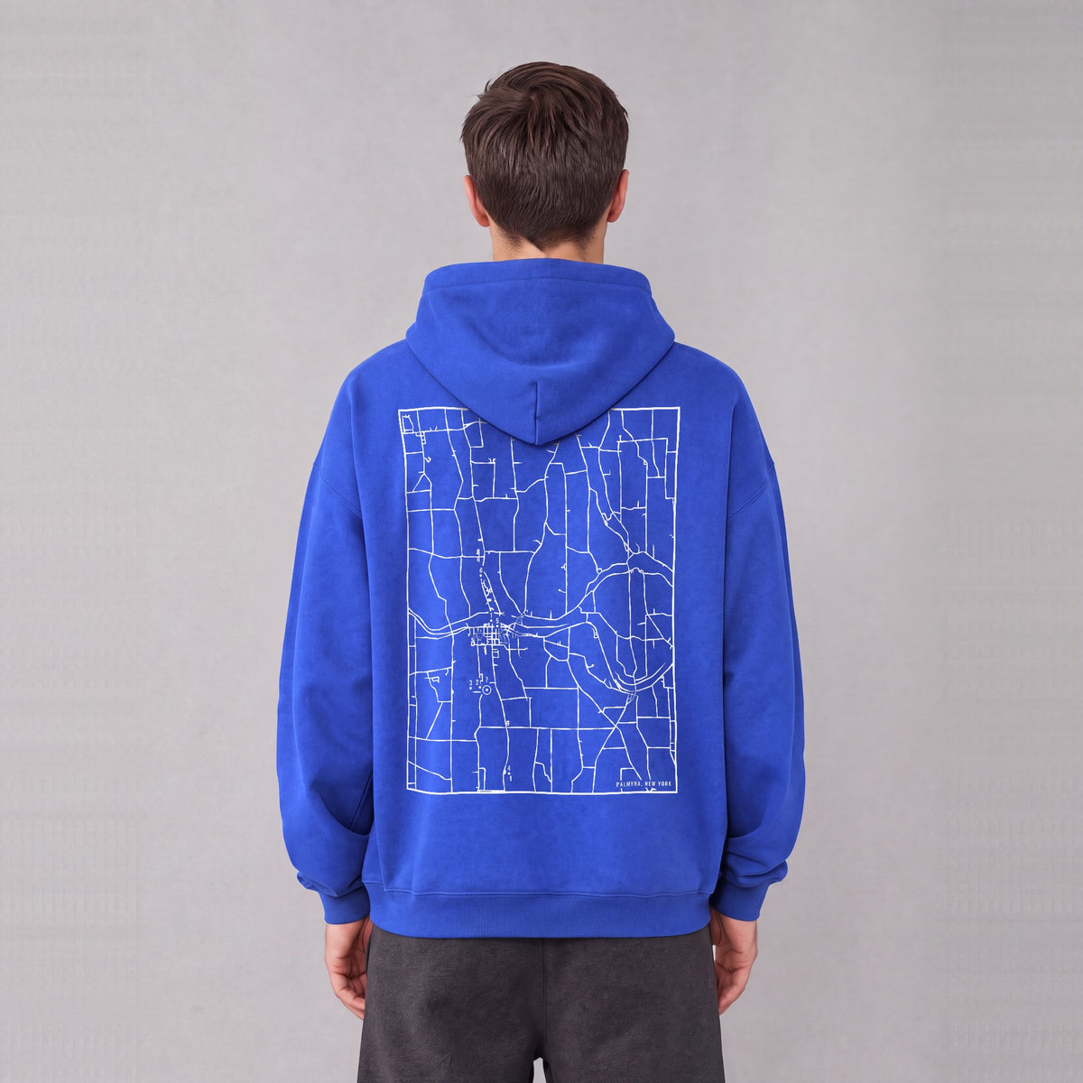 Palmyra map hoodie, back print on model - Royal Blue