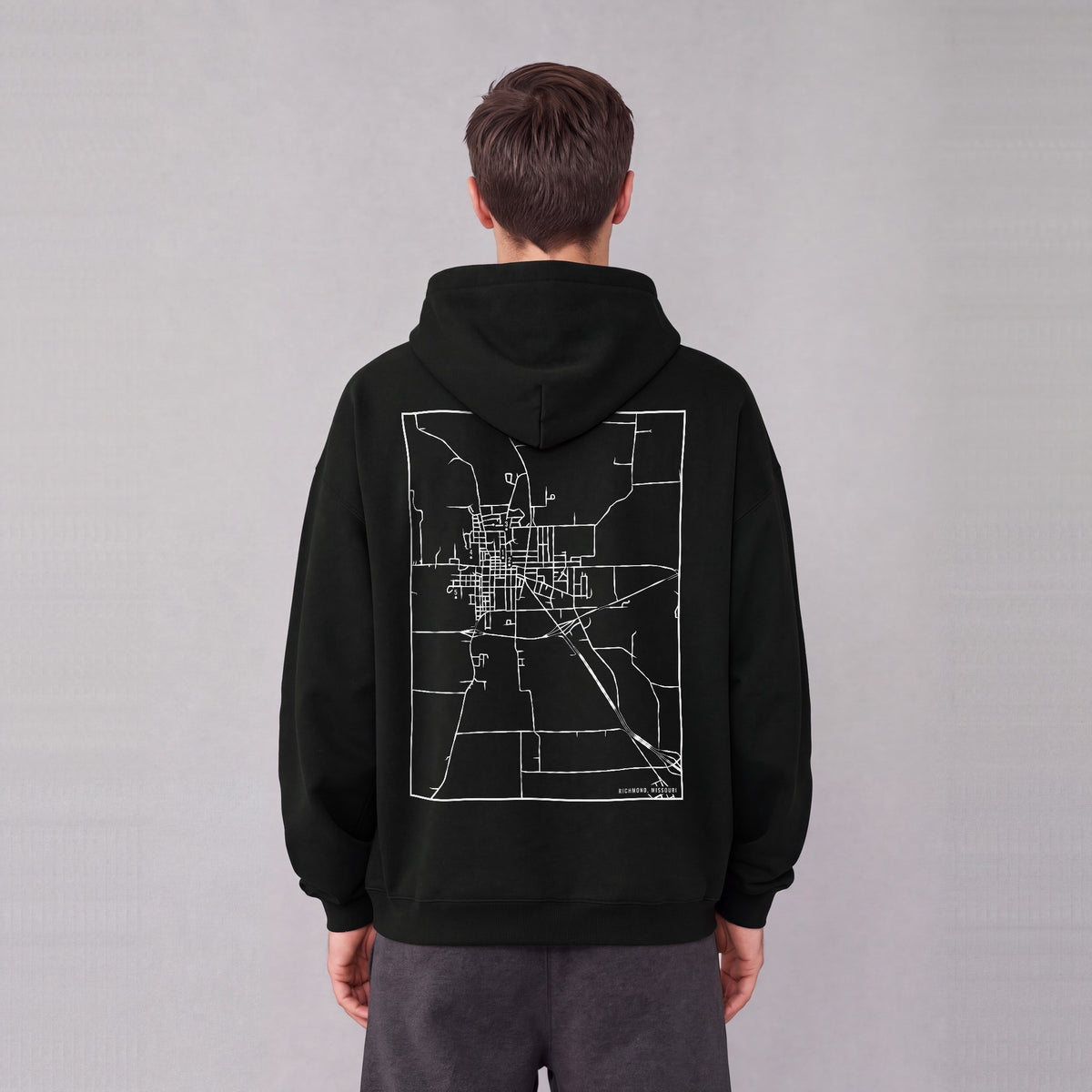 Richmond map hoodie, back print on model - Black