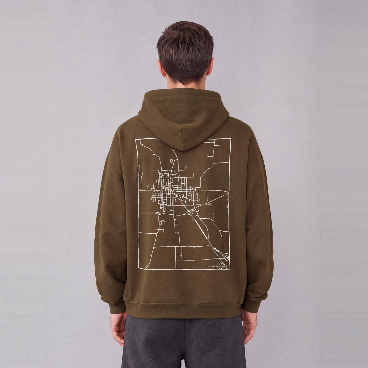 Richmond map hoodie, back print on model - Coffee