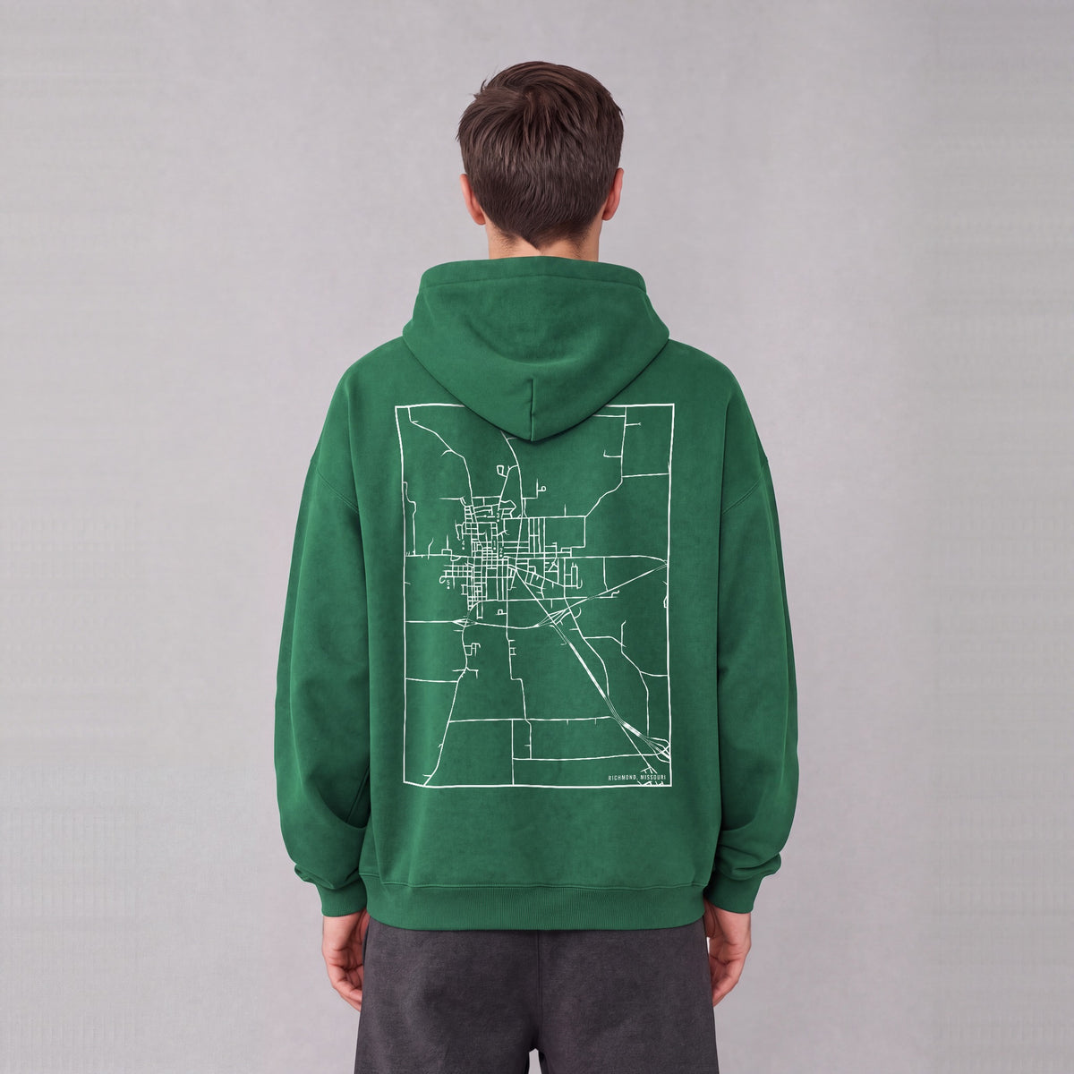Richmond map hoodie, back print on model - Eden Green