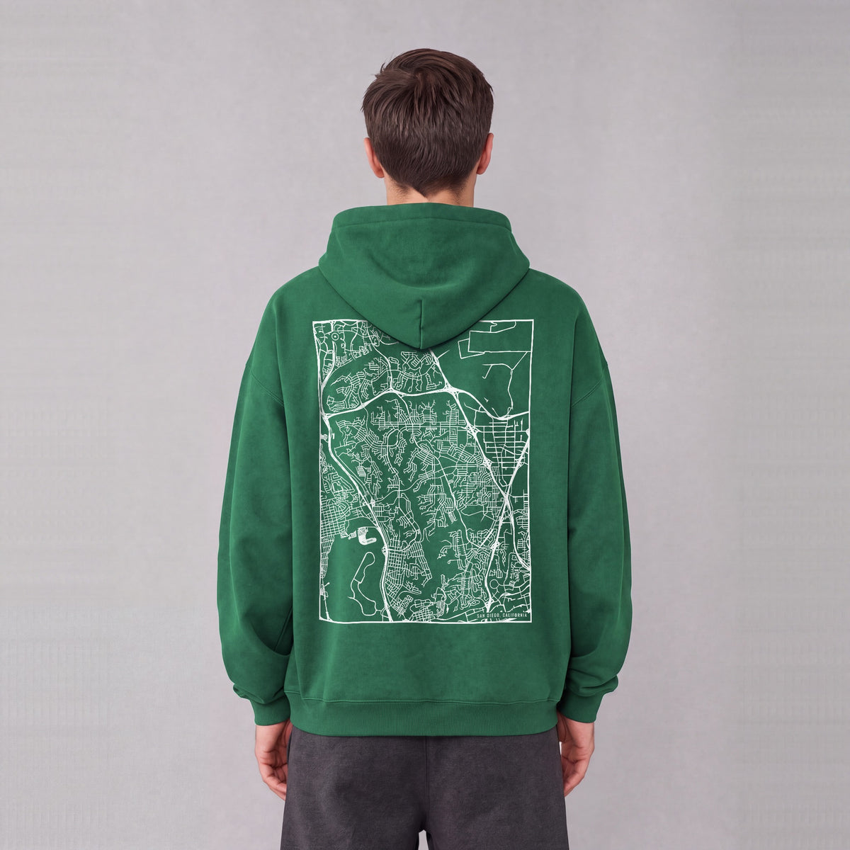 San Diego map hoodie, back print on model - Eden Green