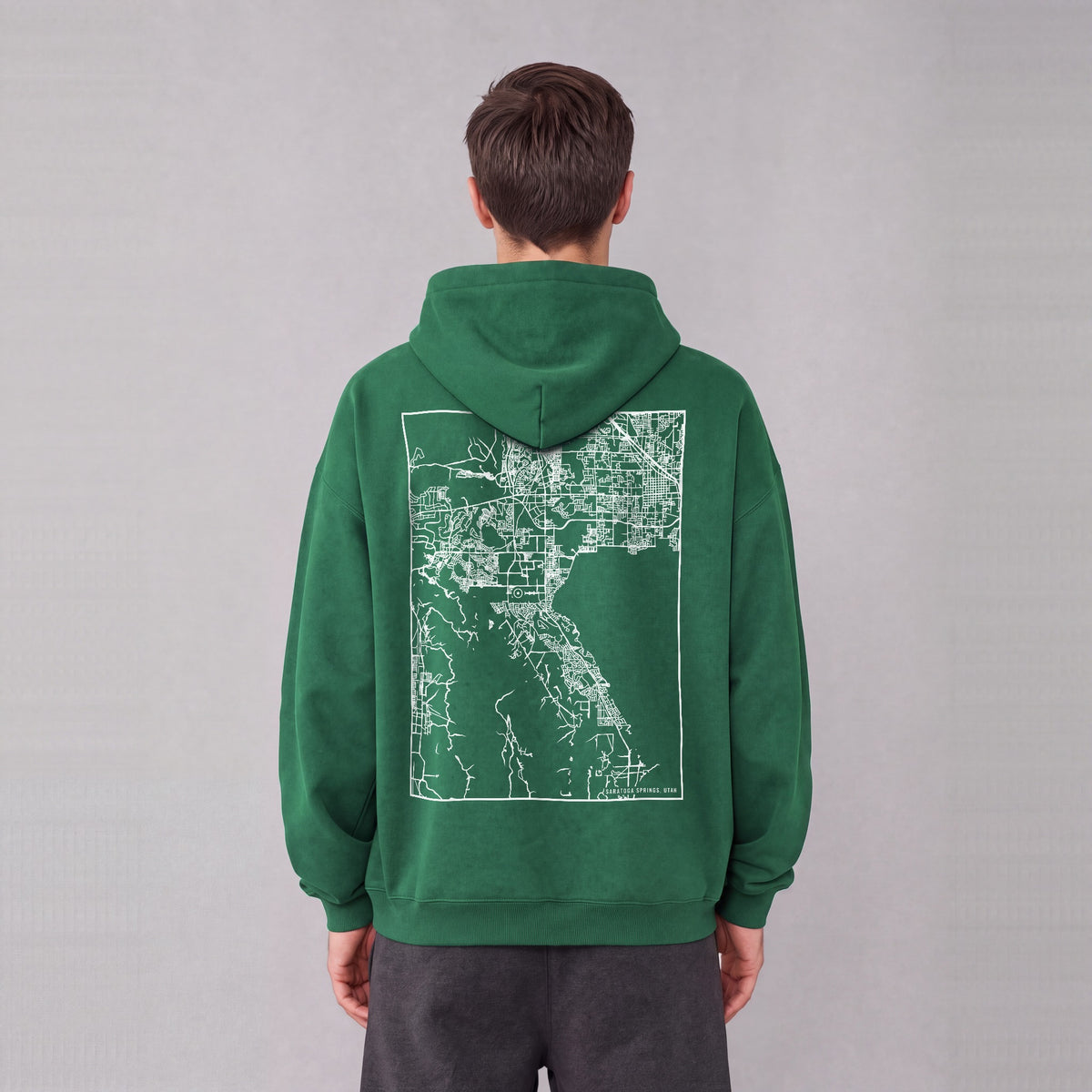Saratoga Springs map hoodie, back print on model - Eden Green