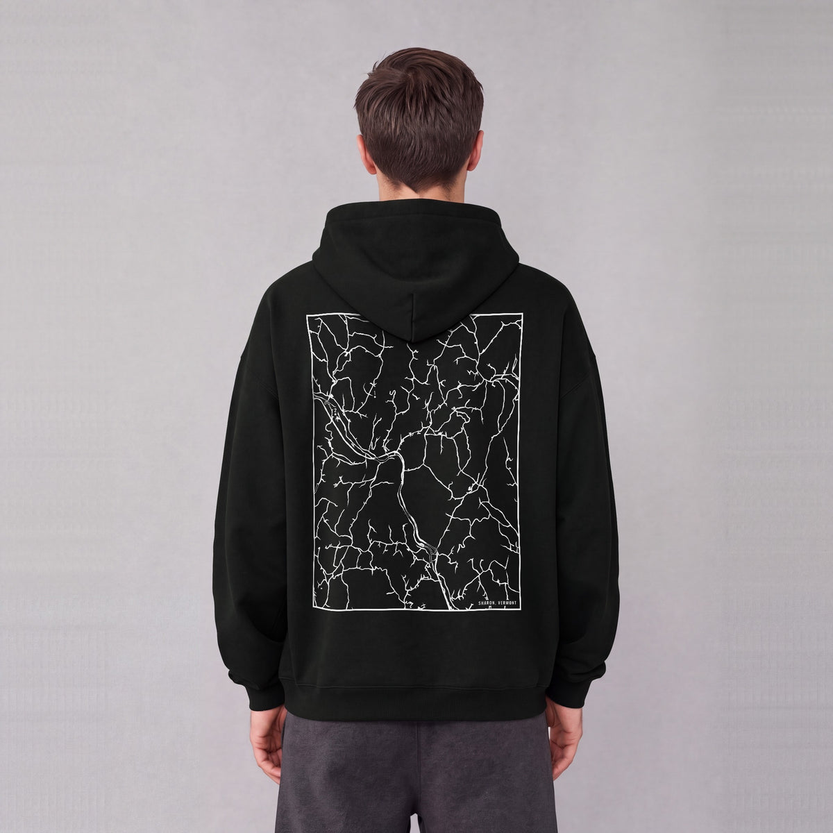 Sharon map hoodie, back print on model - Black