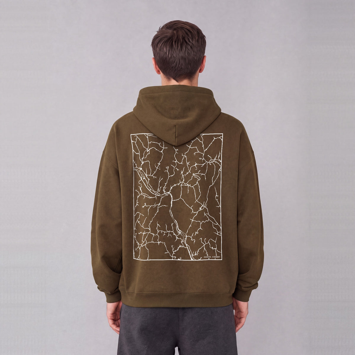 Sharon map hoodie, back print on model - Coffee