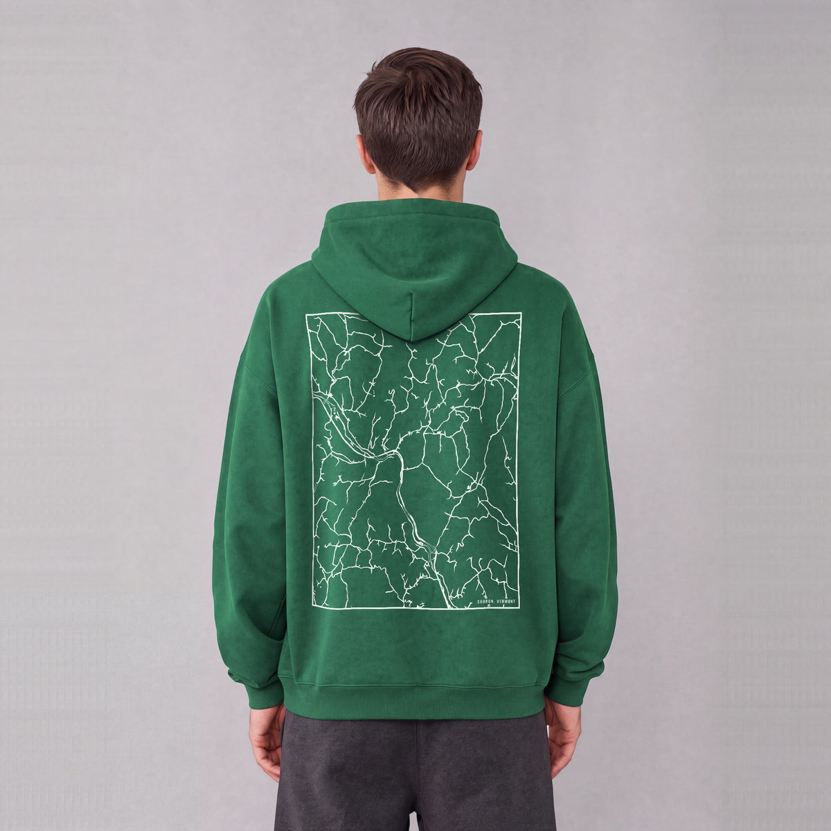 Sharon map hoodie, back print on model - Eden Green
