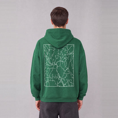 Sharon map hoodie, back print on model - Eden Green