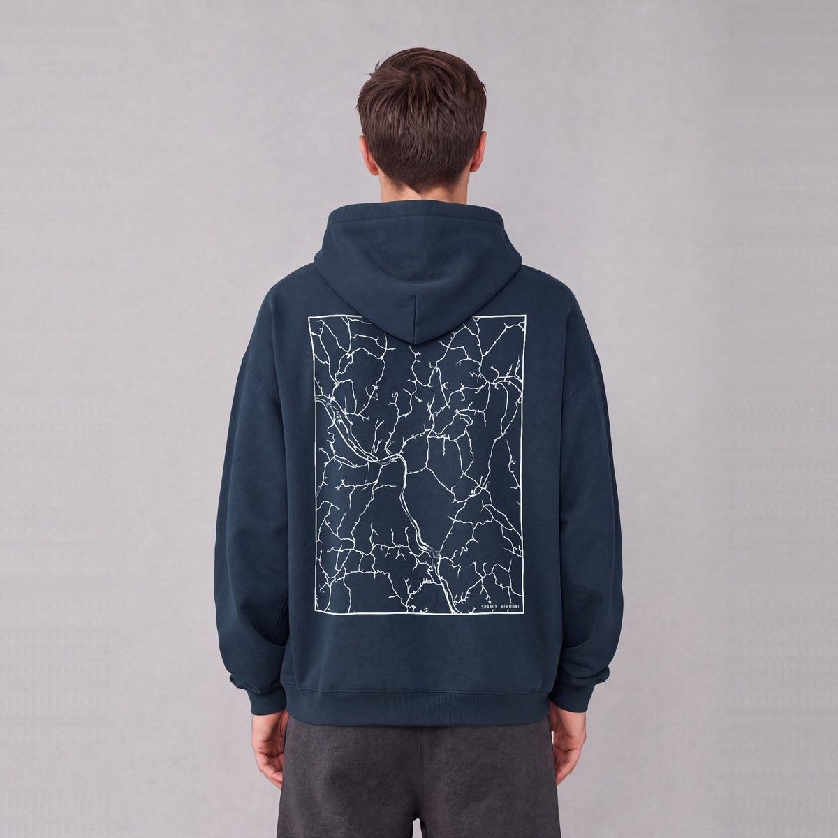 Sharon map hoodie, back print on model - Navy Blue