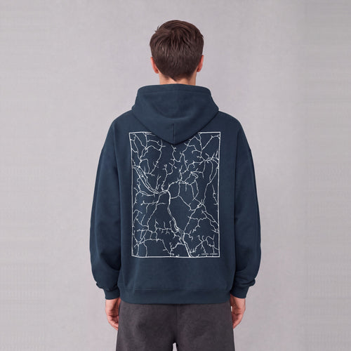 Sharon map hoodie, back print on model - Navy Blue