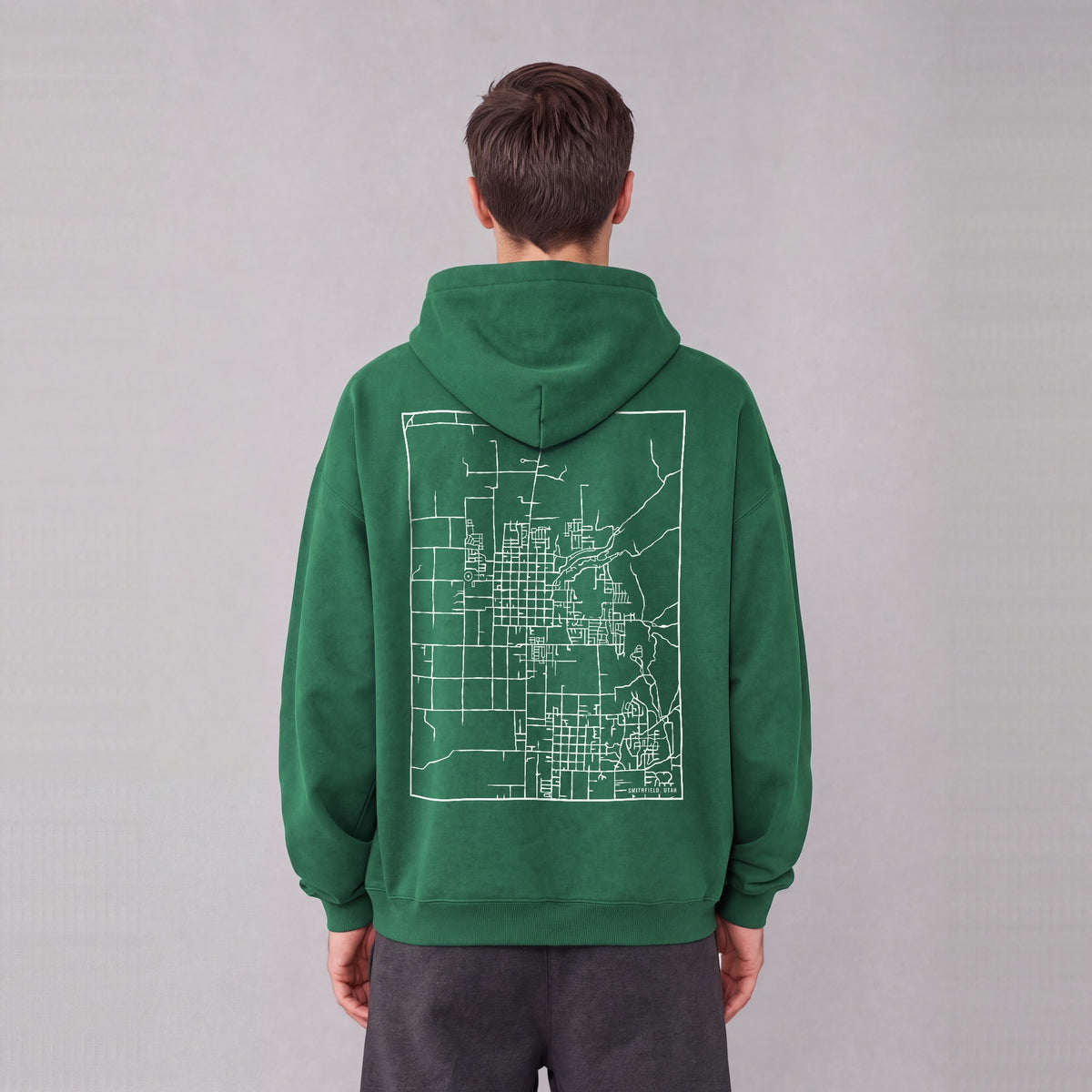 Smithfield map hoodie, back print on model - Eden Green