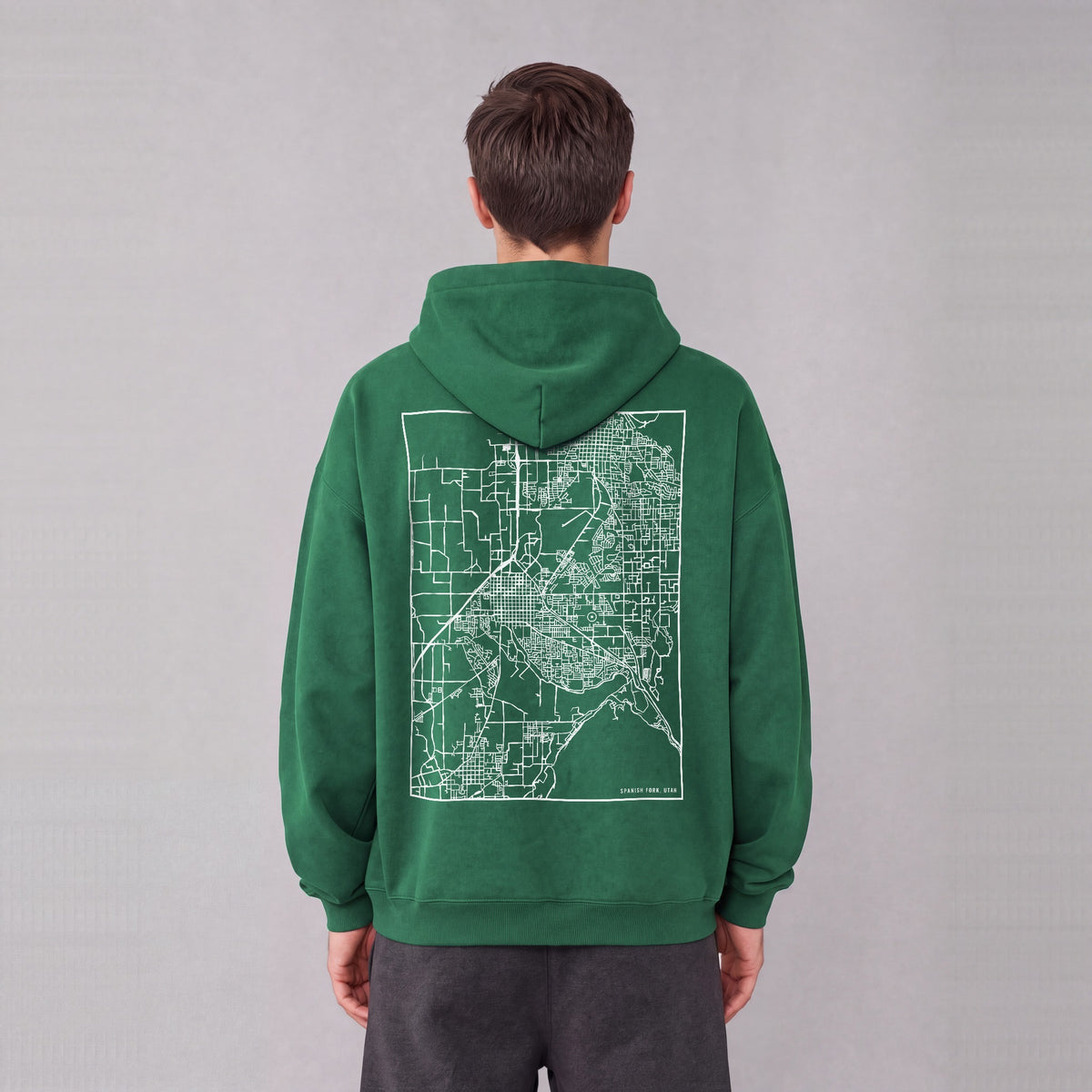 Spanish Fork map hoodie, back print on model - Eden Green