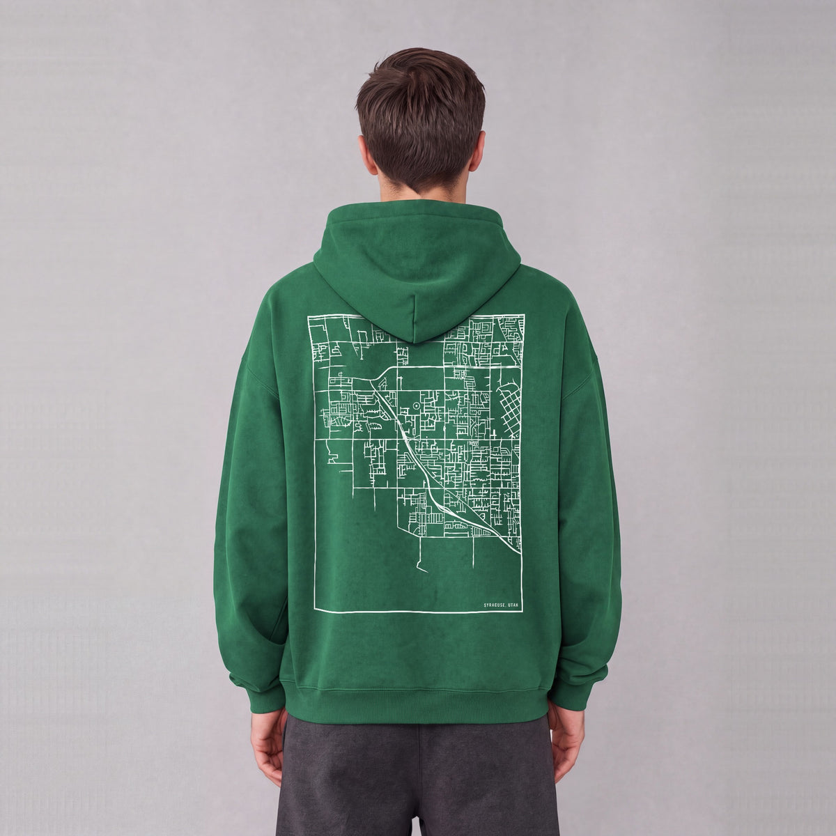 Syracuse map hoodie, back print on model - Eden Green