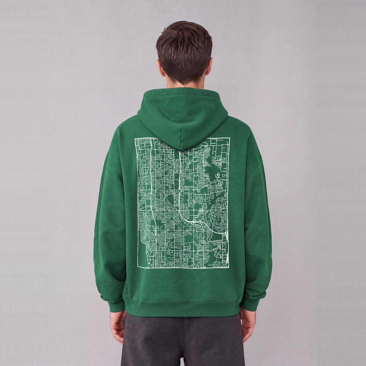 Taylorsville map hoodie, back print on model - Eden Green