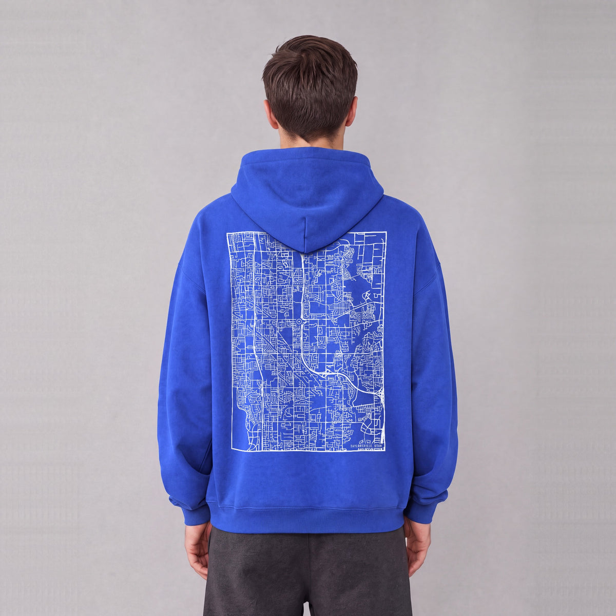 Taylorsville map hoodie, back print on model - Royal Blue
