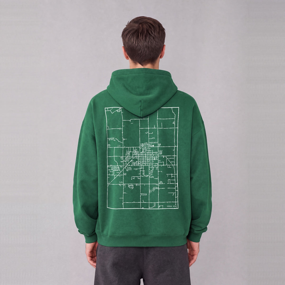 Vernal map hoodie, back print on model - Eden Green