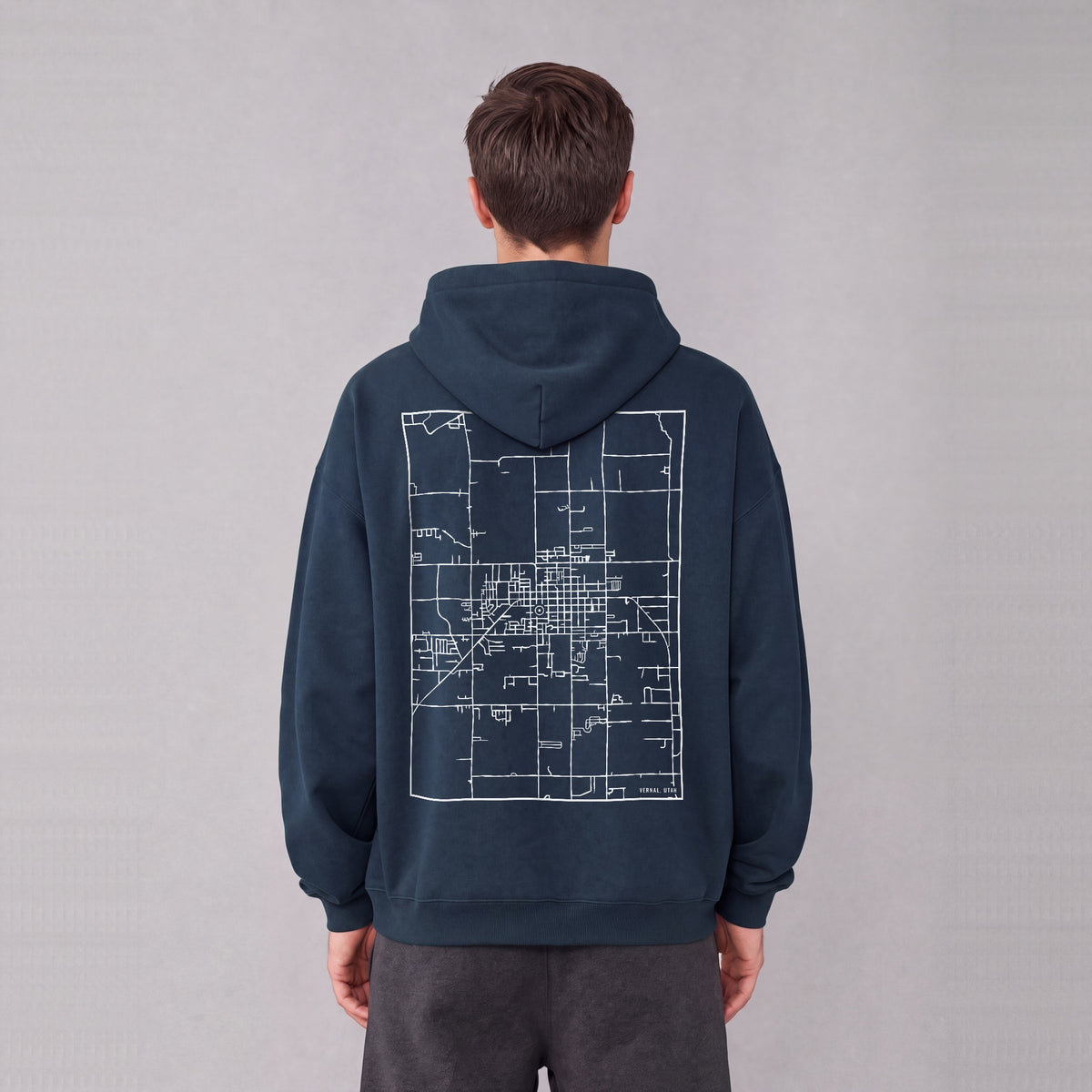 Vernal map hoodie, back print on model - Navy Blue