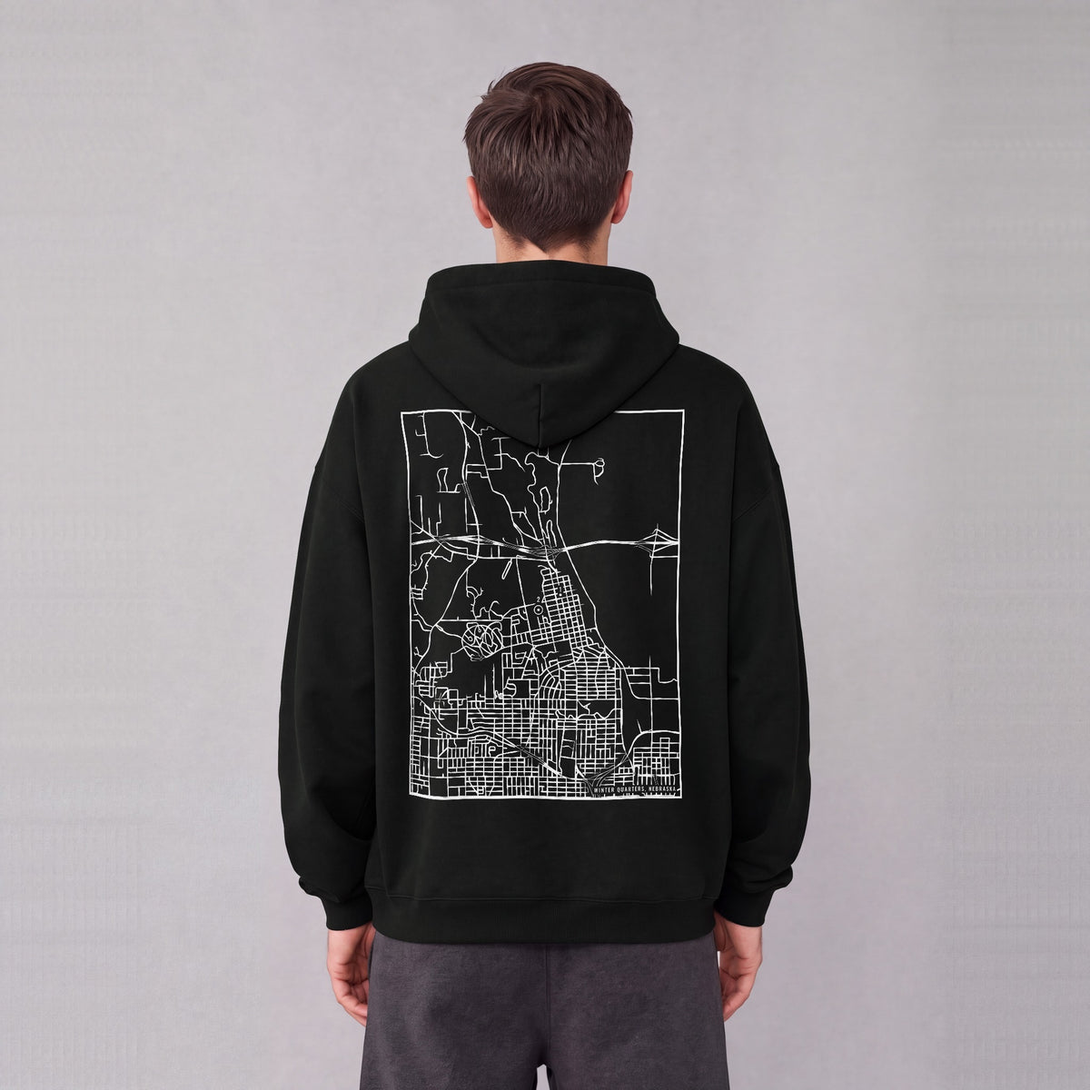 Winter Quarters map hoodie, back print on model - Black