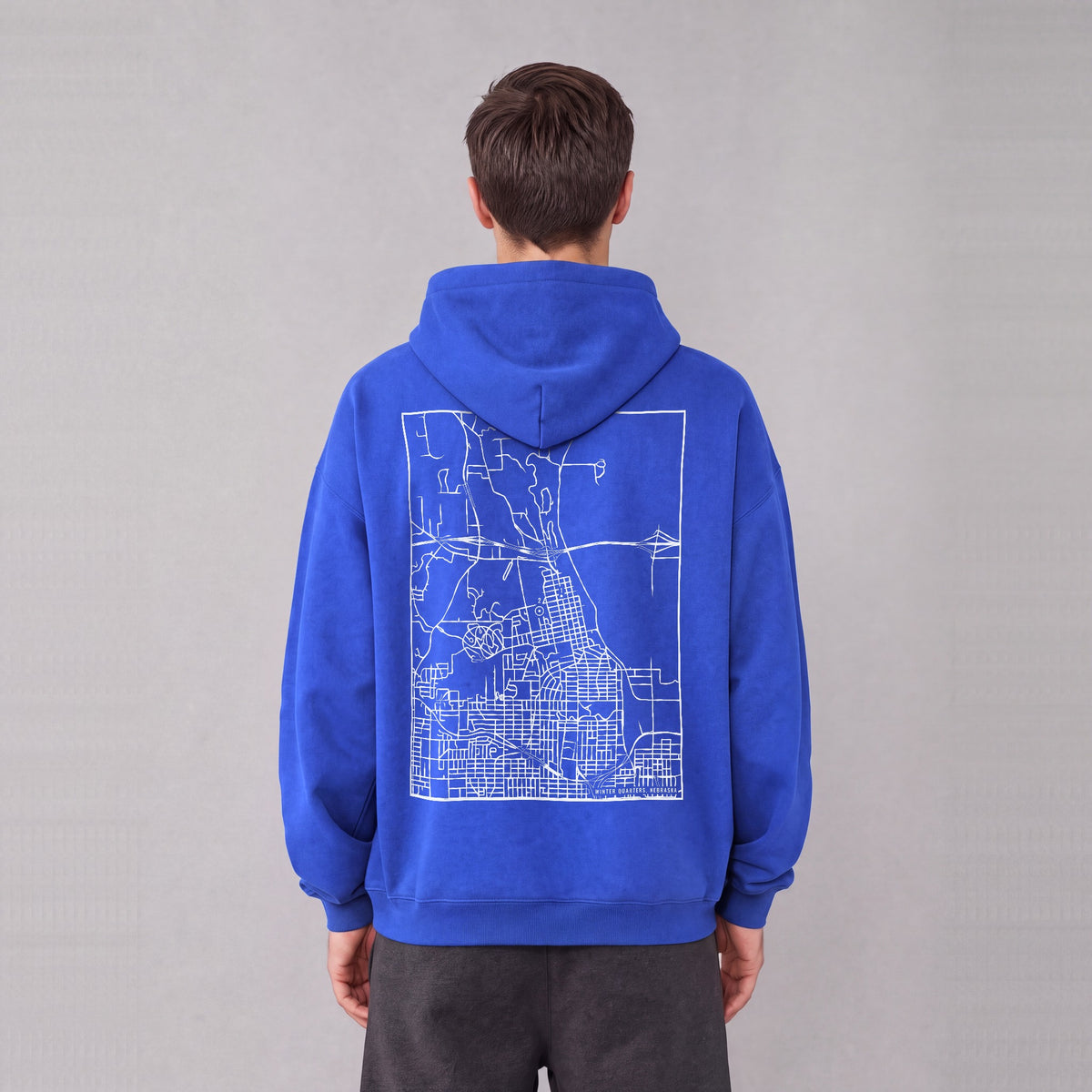 Winter Quarters map hoodie, back print on model - Royal Blue